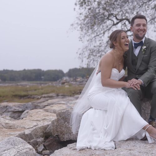 Sequence 0100_02_55_14Still004 bride and groom laughing on rock near ocean marsh in new hampshire wedding videography