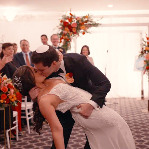 Humblebee Wedding Avenir Walpole MA 2 Humblebee Wedding Avenir Walpole MA, newlyweds kiss with celebrating bridal party in the background