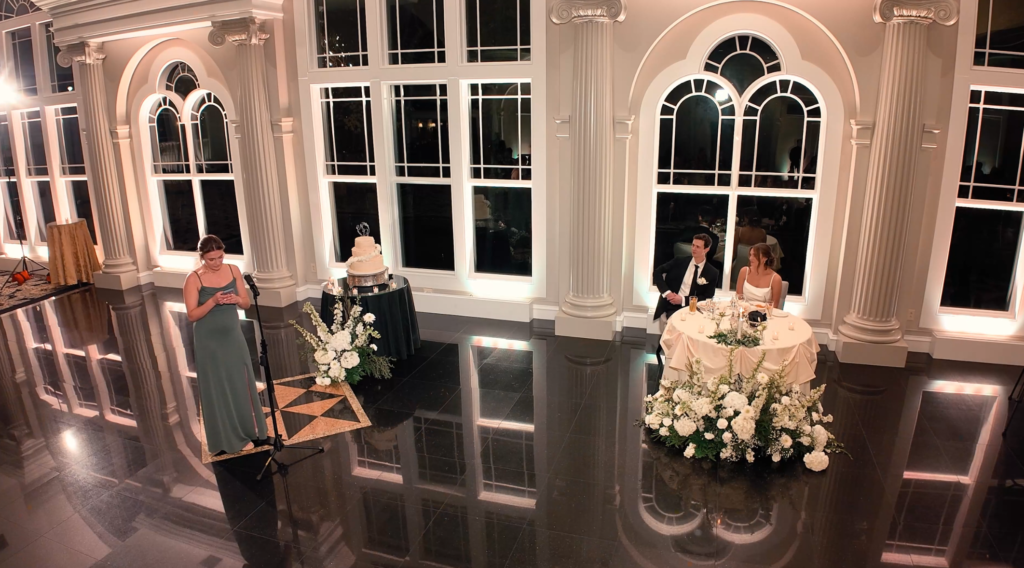 Humblebee Wedding Films The Riverview, newlyweds listen to a toast during the reception
