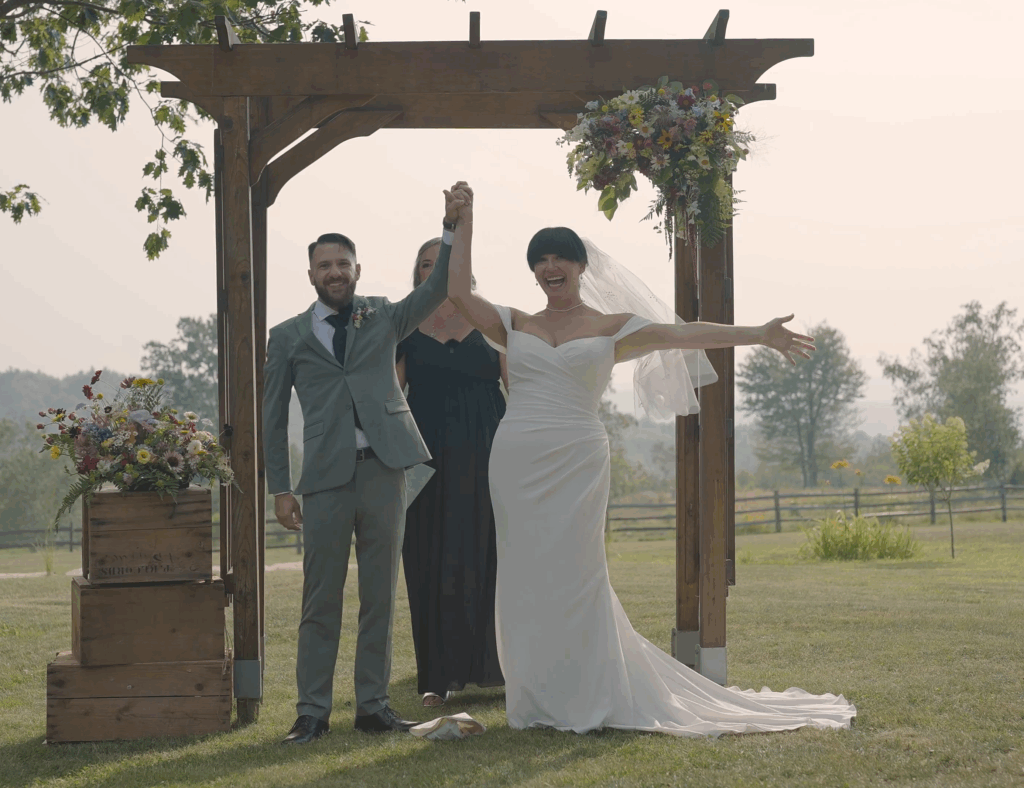 Humblebee Wedding Videography Cold Spring Farm, bride and groom leaving altar with hands up in celebration