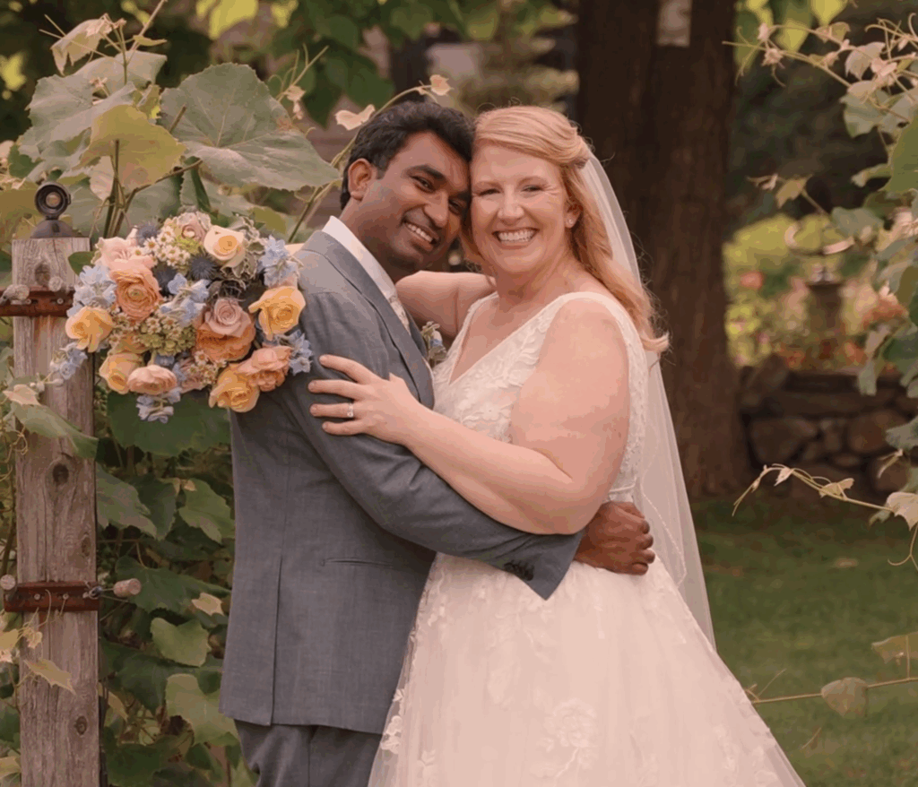Humblebee Wedding Films Birch Wood Vineyards, newly weds pose happily with vineyards in the background