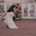 Couple dancing in a garden setting for documentary style wedding videography.