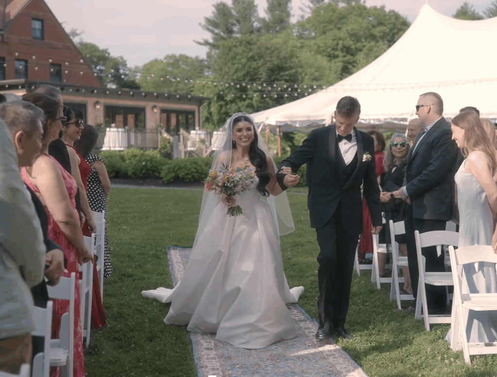 Humblebee Wedding Films Boston wedding content creator, newlyweds walking down the aisle hand in hand