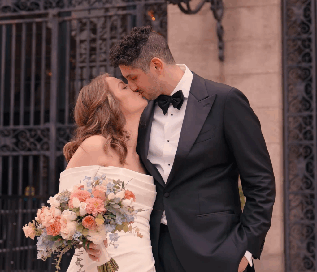 Humblebee Wedding Films Boston Public Library, newlyweds kiss in front of library