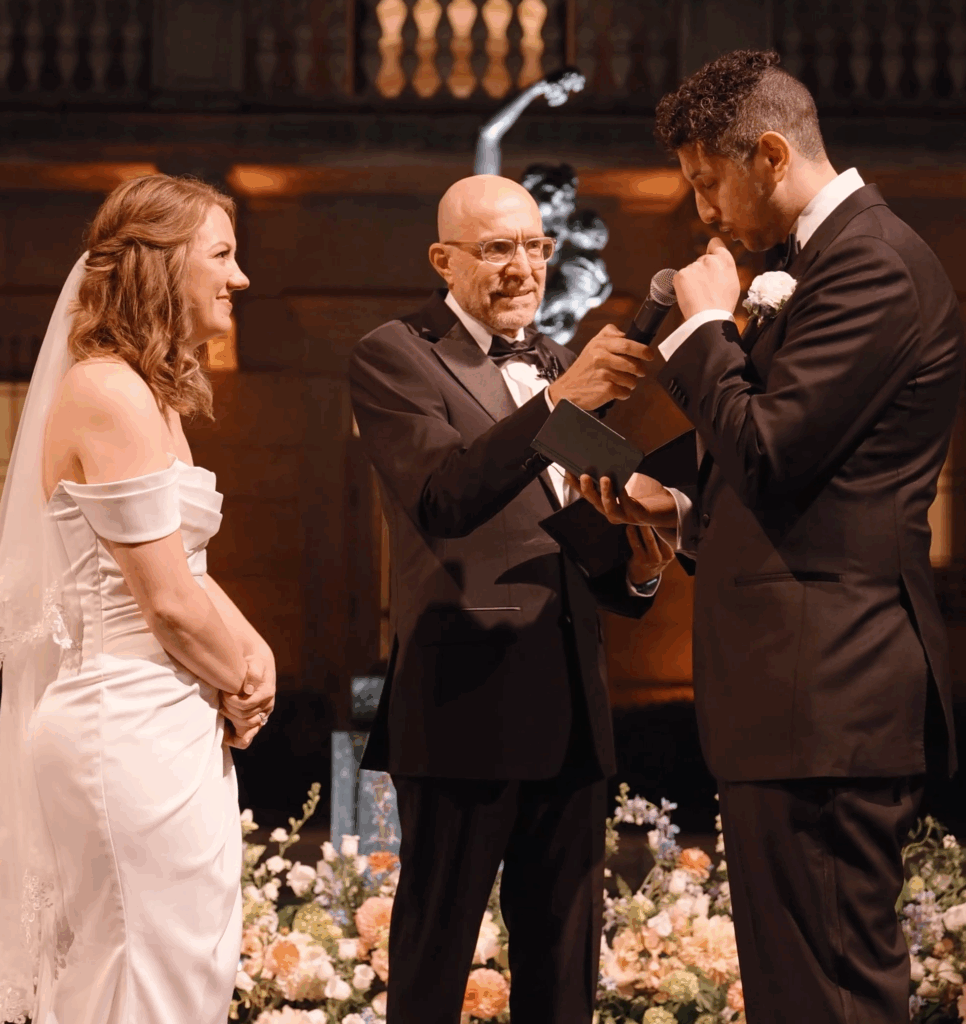 Humblebee Wedding Films Boston Public Library, couple stands before officiant to share vows